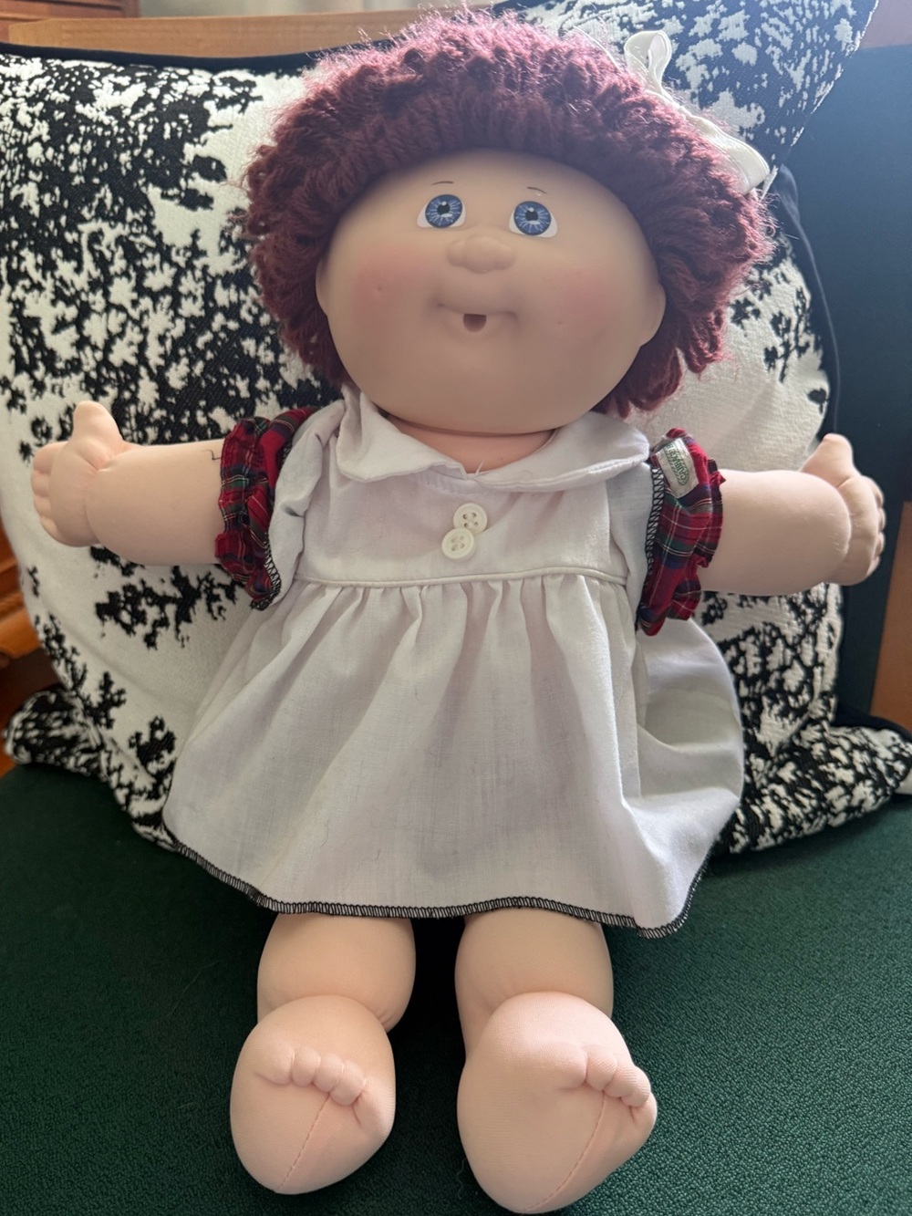 Plush Baby Doll with Burgundy Yarn Hair and White Dress